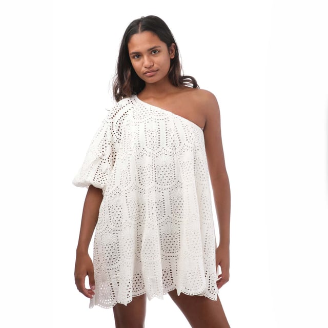 Women's Sundress Louisa Short Dress in White.- Flared long sleeve.- Cinched at the cuff with an elastic band.- Pineapple eyelet fabric.- Asymmetric piece with a flared silhouette.- 100% Cotton. Ref: R24012.