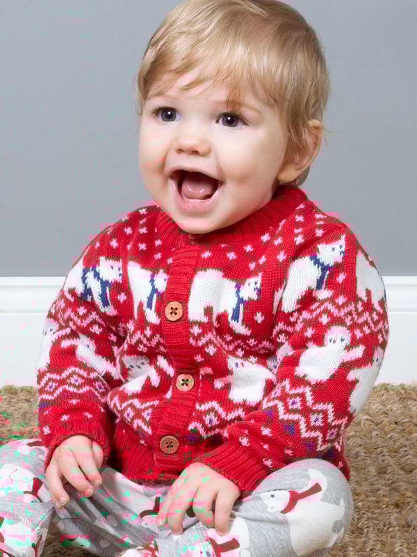 A simply gorgeous knitted layer that offers both comfort and style and is the perfect winter cardigan for your little one. In a midweight knit with a beautiful red and cream polar pals design, this fab layer with coconut buttons is so snug and versatile it will be worn again and again.