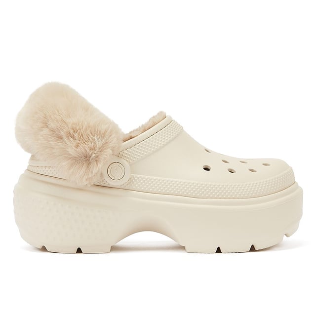 Experience unmatched comfort with these clogs, boasting excessively chunky soles that give you a 5.5cm / 2.1-inch heel height for added style. Their lightweight construction ensures all-day wearability, and the fully lined interior keeps your feet cosy. Plus, the fuzz-wrapped pivotable backstrap enhances both the look and feel of these exceptional clogs. Jibbitz™ holes makes it easy to personalise.