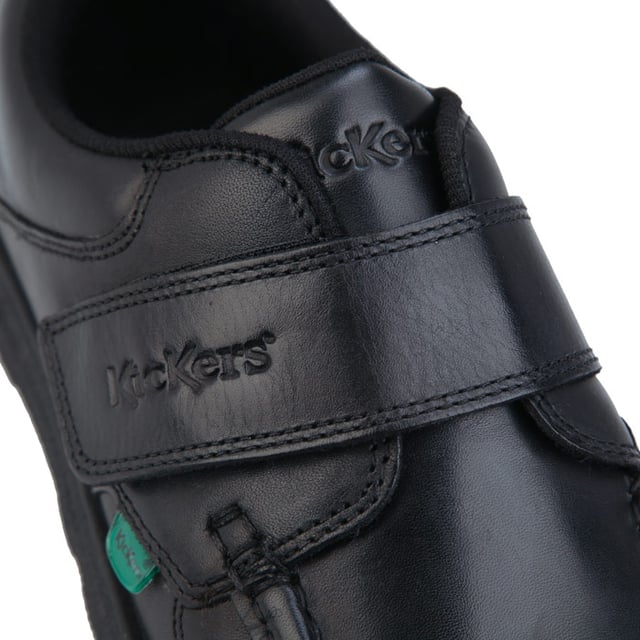 Junior Boys Kickers Fragma Strap Leather Shoe in black.- Moccasin style upper.- Touch and close double fastener. - Padded ankle collar. - Signature green logo tabs.- Kickers branding to the top strap.- Stitched detail.- Durable rubber outsole.- Leather upper  Textile lining  Synthetic sole. - Ref: 114863