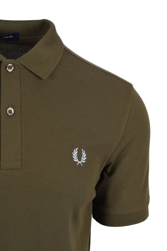 Fred Perry Plain Polo Shirt Uniform Green
An easy to style polo shirt by Fred Perry for your casual wardrobe. In an khaki green colourway boasting the signature Laurel Wreath in contrasting colours it is a minimal design. Pair with your favourite denim and designer trainers for a relaxed look.

100% Cotton
Two Button Placket
Ribbed Cuffs
Signature Fred Perry Branding
Style: M6000