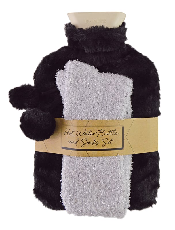 If you're looking for a luxury gift for your friend, family or loved one then look no further than our Hot Water Bottle & Socks Gift Set. This adorable gift set comes with a soft and cosy pair of socks and a 1.5 litre Fur-Like Hot Water Bottle.This luxury style gift set comes with a Fur-Like Hot Water Bottle which holds 1.5 Litres of water which is ideal for keeping you warm on those cold winter nights. It is made from plush microfibre material and it has a cute pom pom decor on top.The cosy pair of socks included are made of a super soft fluffy material which makes them perfect for snuggling up on the sofa when it's cold outside. It's the perfect gift idea and they’re even Machine Washable!We have 3 colour options available which are: Black, Grey or Pink so there is sure to be something for everyone! It makes a great gift to a loved one or Christmas present but it's also perfect if you just want to treat yourself.