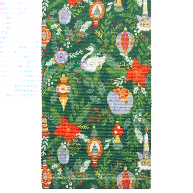Get into the Christmas spirit with this wonderfully festive table runner. Featuring a digital printed design on woven polyester fabric of Christmas foliage and traditional tree decorations, including vintage baubles, candles and even a swan in vivid seasonal colours. This beautiful table runner will transform and add some instant seasonal cheer to your Christmas dining table.