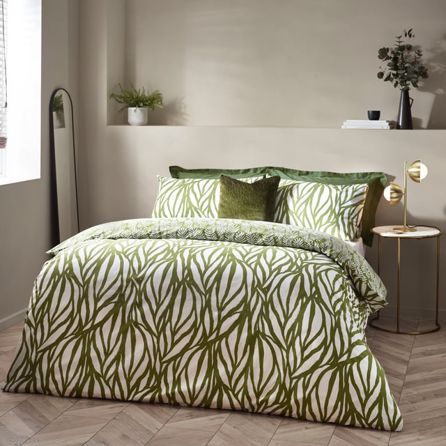 Enjoy some natural sleep in the modern, abstract art-inspired Frond duvet cover set. Featuring a linear leaf design, using fluid painted lines to create movement and texture to your interior. The reverse displays intricately printed fronds on a natural green background, to give you a choice of two nature-inspired designs in one. Either way, the Frond duvet cover set adds a touch of nature to a modern, neutral interior. This product is certified by OEKO-TEX® showing it has been sustainably made.