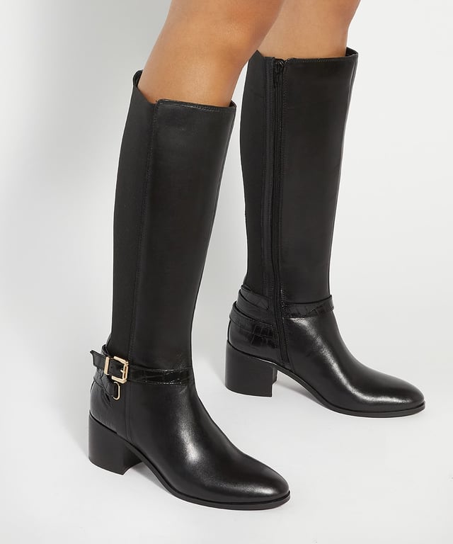 Dune Ladies Tilburies - Leather Round Toe Riding Boots This knee high boot has a curved back to accommodate your calves. It comes with an eyecatching gold zip and a chunky mid heel. Team it with skinny jeans and a baggy knit for a cosy winter look.
