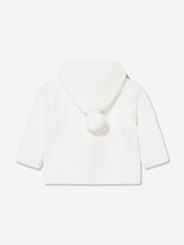 Wrap your little one in the epitome of elegance with the Paz Rodriguez Baby Wool Knitted Coat in Ivory. Crafted in Spain, this luxurious coat offers both warmth and style for AW2024: Exquisite Craftsmanship: Handmade in Spain, ensuring unmatched quality and attention to detail.   Pure Wool: Made from soft, premium wool for ultimate comfort and warmth.   Timeless colour: The ivory hue ensures versatility and classic style.   Unisex Design: Perfect for boys and girls, making it an ideal wardrobe staple.  Elevate your child's fashion this season with this exclusive, cosy coat!