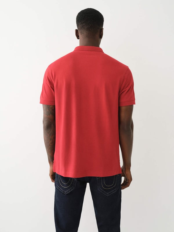 Pop that collar with the Buddha Patched Logo Polo Shirt. Crafted from soft cotton, this men’s polo features a basic collar. half-button placket, and short sleeves. Finished with a relaxed fit, ribbed trim, and a chest Buddha patch.