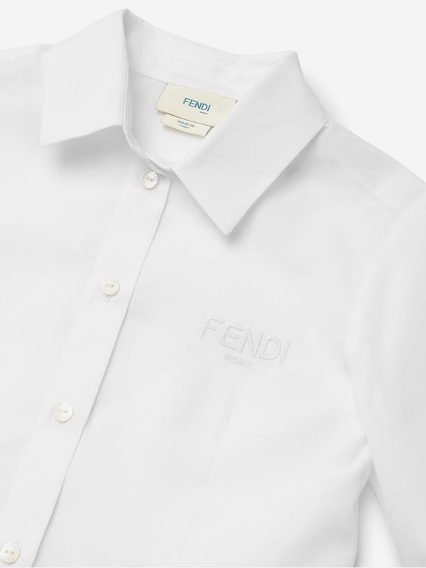 Revamp your little girl's wardrobe with the luxurious Girls Cotton Shirt in White by Fendi Kids, straight from Italy. Perfect for AW2024, this premium garment merges classic charm with contemporary flair.  Exquisite Italian Craftsmanship: Meticulously tailored, promising unmatched quality and elegance.  Iconic Design: Features Fendi's signature playfulness, ideal for standing out in any crowd.  Supreme Comfort: Constructed from the finest cotton, ensuring a soft and cosy fit for all-day wear. This pristine white shirt isn't just clothing; it's an investment in style and comfort. Embrace exquisite fashion today!