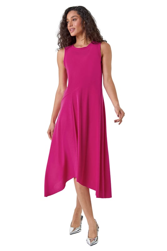 Asymmetric Sleeveless Stretch Midi Dress from Roman. Keep your style simple and chic this season with this sleeveless Dusk midi dress. Cut from a comfortable stretch jersey fabric, this dress features a modest round neckline and a Summer ready sleeveless style. Cut in a flattering fit and flare shape with a floaty asymmetrical hemline, this dress is designed to pull-on for quick and easy dressing. Falling to a modest midi length with a unique diagonal dropped waist, this dress can be dressed up or down to suit any occasion. Add sandals and sunnies for a simple Summertime look!