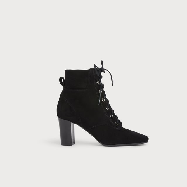 The lace-up boot has autumnal appeal, and our Avery ankle boots are a new lace-up addition to our collection this season. Crafted from beautiful black suede, they have softly-pointed toes, silver eyelets and hook and eye detail, a padded collar, back tab and a stacked block heel. Wear them with Seventies-inspired midi dresses or with denim flares.