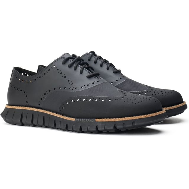 Mens black Cole Haan zerogrand remastered shoes, manufactured with leather and a rubber sole. Featuring: flowerfoam sole, brogue detail, cole haan branding and dandelion rubber.