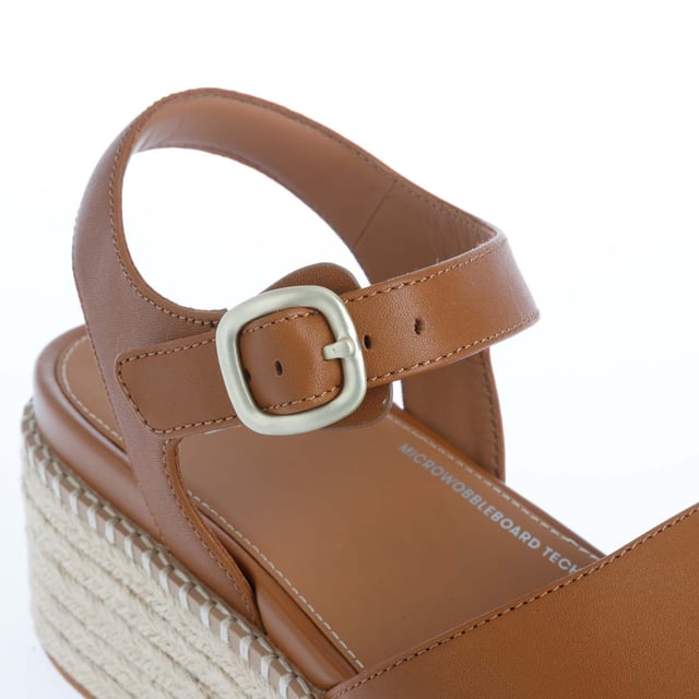 Womens FitFlop Eloise Espadrille Leather Back-Strap Wedge Sandals in light tan.Elevate your look - in every sense - with espadrille sandals on FitFlop's comfort-engineered high wedge sole.- Smooth high-quality leather uppers.- Lightly padded backstrap with adjustable buckle. - Comfortable cotton twill and leather-lined upper.- High wedge sole wrapped in natural jute for a laidback-chic summery vibe.- Statement stitching detail around the top of the sole.- Microwobbleboard midsole - absorbs shock  diffuses pressure and provides extraordinary comfort.- FitFlop branding to footbed.- Slip-resistant rubber outsole.- Average to wide fit.- Wedge height 2.8“ - 7.1cm approximately.- Leather and textile upper  Leather and textile lining  Synthetic sole.- Ref: HS5-592Measurements are intended for guidance only.