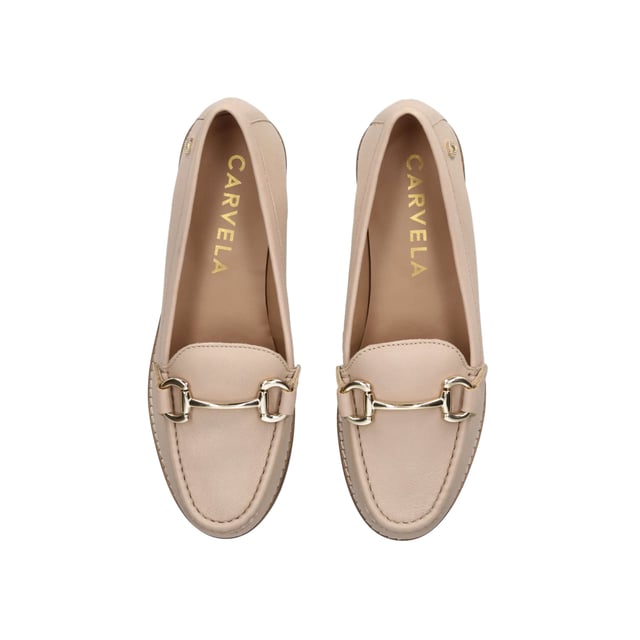 The Snap is a slip on loafer crafted from a blush leather. The gold tone horsebit detail sits across the toe of the shoe. There is a small gold tone Icon C at the outer heel.