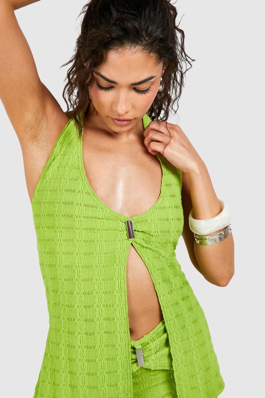 Petite Textured Split Front Halter Neck Top Gain some serious style points this season in this petite top. Cut shorter to ensure the perfect fit, our tops for petite women are designed for queens 5'3'' and below. From petite t-shirts to petite blouses, we've got all the new-season styles you need in your wardrobe. Feeling casual? Dress it down with a pair of straight leg jeans and chunky trainers. If out out is more your vibe, team with some distressed hem shorts and killer heels for a major style statement. Style: Crop TopFabric: PolyesterLength: RegularNeckline: HalterneckSleeve Length: Sleeveless