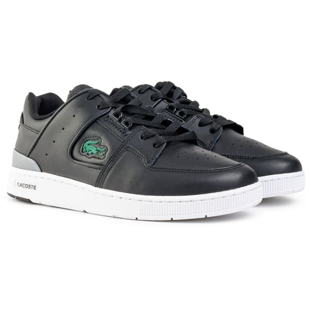 Mens black Lacoste court cage trainers, manufactured with leather and a rubber sole. Featuring: textile lining, ortholite insole, iconic croc branding and cup sole construction.