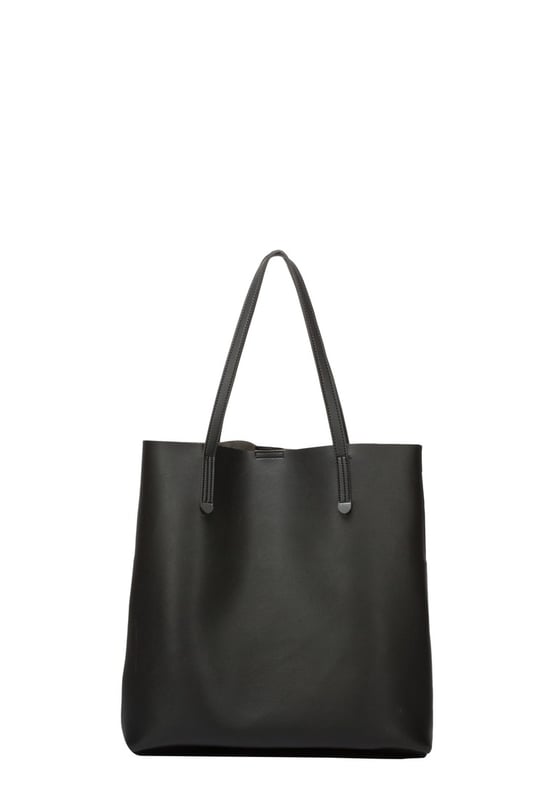 The Annalise XL Tote from the Lori collection uses an unlined smooth PU which remains flexible when you wear it. Simple details such as the debossed Claudia Canova logo and double front pocket detail and the soft and flexible shape makes this bag lightweight and sleek, great for storing all your daily essentials. Inside is a removable zippered pouch, which you can clip in place to keep your more valuable items extra safe. Features: , Unlined smooth PU, Claudia Canova blind debossed logo, Twin grab handles, Soft and flexible shape, Removable inner pouch with zip fastening, Double front pocket detail, Mag-dot fastening Style Ref: 84382 BLACK