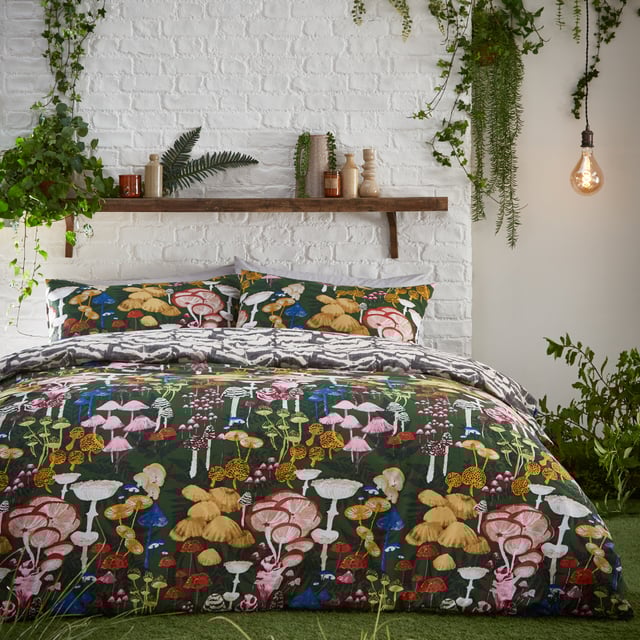 Mushrooms are enjoying their moment in home and fashion designs right now! This is reflected by the amazingly detailed hand-painted Amanita duvet cover set which celebrates the intricate world of fascinating fungi and mystical mushrooms. They glow brightly against the dramatic coloured background, which gives this design a unique twist, alongside surrounding organic shapes. The abstract printed reverse is inspired by the textural underside of a mushroom and is in natural tones for a more neutral look if desired. A fabulous on-trend design which will add both intrigue and a hint of mystery to your bedroom.