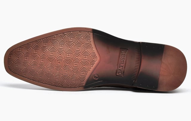 A wardrobe staple, these Catesby England Remington mens brogues are sure to elevate your smart-casual attire. The premium leather upper features classic punch hole detailing and intricate designer stitching, all in an on-trend colourway designed to impress. A slimline outsole completes the look and ensures sophisticated looks and increased traction. 
 - Leather upper
 - Classic brogue detailing throughout
 - Lace up fastening for a secure fit
 - Sturdy rubber outsole
 - Catesby England branding