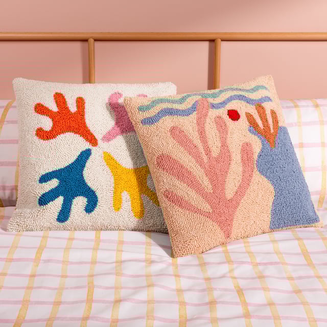 The Corals cushion gives those beach day vibes. It is made up entirely of a unique loop tufted cotton to create a cool abstract design of a sea bed and beach, with large corals growing nearby. Finished with a polycotton canvas reverse, knife edge trim and zip fastening. A fun, friendly and huggable fashion piece to throw on your sofa and help create your own unique living space. Size: 45 x 45cm.