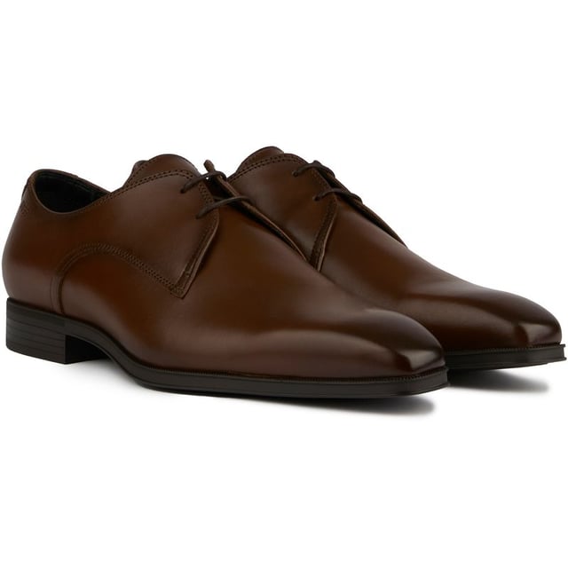Step Out In Timeless Style With The Boss Theon Derby. Crafted From Rich Brown Leather, This Classic Lace-up Shoe Is All About Sleek Sophistication. Padded Insoles Cushion Your Feet While The Durable Rubber Soles Keep You Steady With Every Dapper Stride. Slip Into These Fine Leather Derbies To Add A Polished Touch To Any Outfit.