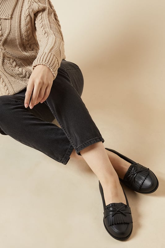 Faux leather loafers with a wide fit for added comfort
Stylish tassel detailing adorns the vamp
Moccasin-inspired stitching adds a touch of flair
Flat heel offers all-day wearability
Versatile design suitable for day-to-night occasions

Effortlessly transition from desk to dinner with these chic wide fit loafers from Dorothy Perkins. The faux leather construction exudes a polished look, while the tassel embellishments and moccasin-inspired stitching lend a touch of playfulness. Pair them with tailored trousers for a sophisticated workwear ensemble, or team them with a flowy dress for a casual yet refined weekend brunch look. With their flat heel, these versatile loafers offer all-day comfort, making them an ideal choice for any occasion.