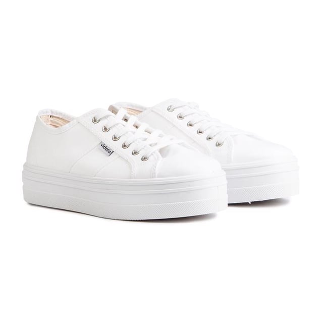 Bring Some Life And A Little Retro Vibe Into Your Trainer Collection, With The Women's Platform Plimsole From Victoria. Crafted From Strong Canvas, The Stylish All-in-white Trainers Are Finished With A Vulcanised Rubber Sole And Metal Eyelets.