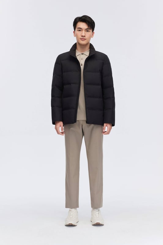 The Men's Classic Business Goose Down Jacket offers both warmth and elegance. With its luxurious 700+ fill goose down, heat-retaining lining, and showerproof seams, it ensures comfort in any weather. The sleek stand-up collar and refined design make it perfect for a professional, polished look.