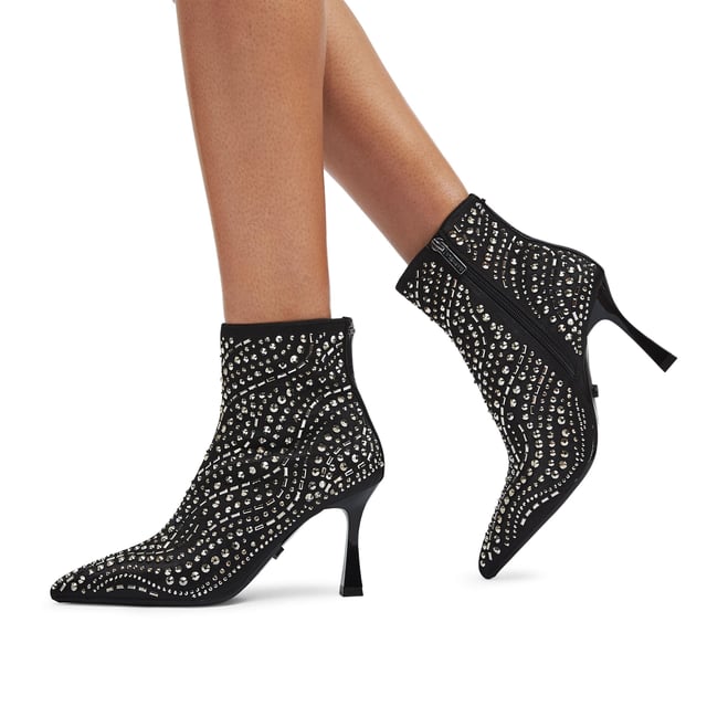 The Carvela Catwalk ankle boot features a black satin upper with gunmetal studs across the upper. The heel is in a flared design. Heel height: 8.5cm.