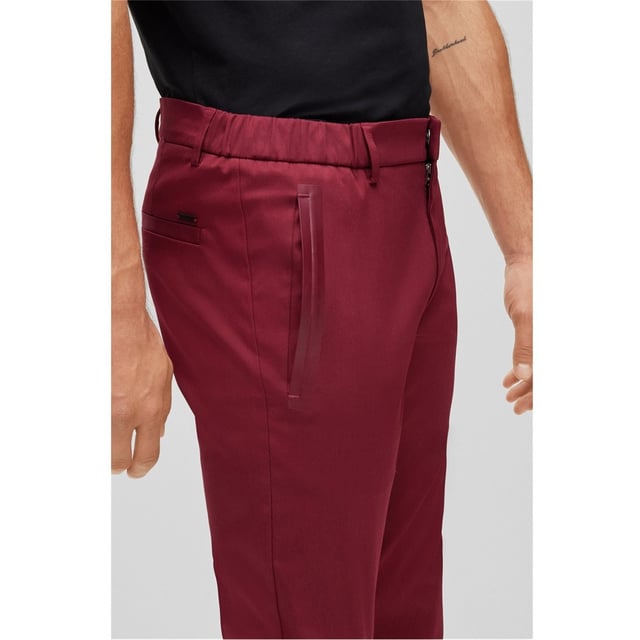 BOSS Rogan 4-1 Trousers - Elevate your performance on the course with the Rogan 4-1 Trousers by BOSS, crafted from cotton stretch making it easier to load your swing and cut in a slim fit for a stylish look. The golf trousers feature two hand pockets with ample space for small item storage, two back pockets, elasticated waist with belted loops for improving wearing comfort, finished with hook and zip closure. The look is completed by the signature BOSS logo embroidered above the back right pocket.