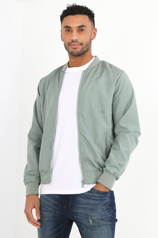 This bomber jacket from Brave Soul is a stylish and comfortable addition to your wardrobe. The ribbed hem, collar, and cuffs provide a classic touch, while the two lower zip pockets add a practical element to the jacket. With a regular fit, this jacket offers a relaxed yet trendy look and is fully lined. Whether you're heading out for a night out or running errands, this bomber jacket is sure to keep you comfortable and stylish.