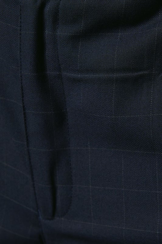Slim fit design for a modern, tailored silhouette
        Distinctive windowpane check pattern adds visual interest
        Belt loops for versatile styling options
        Tapered leg for a sleek, contemporary look
        Suitable for smart casual to formal occasions
    
    These Burton slim fit trousers present a sophisticated option for the discerning gentleman. The windowpane check pattern introduces a subtle yet stylish element, perfect for those who appreciate classic designs with a contemporary twist. Ideal for smart casual events or more formal occasions, these trousers offer versatility in your wardrobe. Style them with a crisp button-down shirt and polished brogues for a refined office look, or pair with a lightweight jumper and smart trainers for a more relaxed weekend ensemble. The slim fit and tapered leg create a streamlined silhouette that's both flattering and on-trend, making these trousers a go-to choice for the modern man who values both style and comfort in his attire.