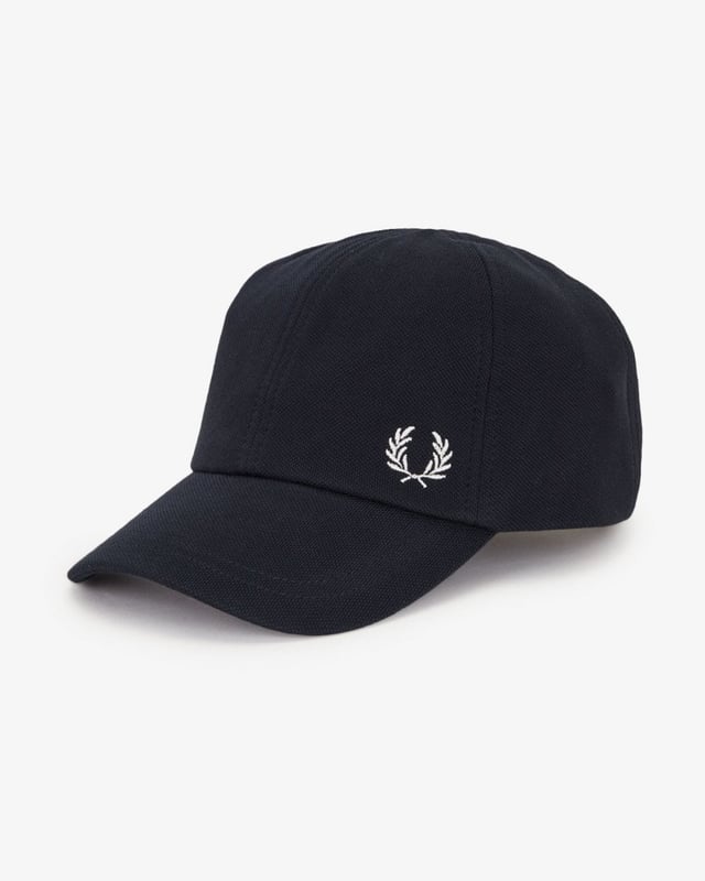A classic cotton cap inspired by the Fred Perry Shirt.  
Cotton piqué fabric / Internal cotton lining and band / Matte metal adjuster clip / Contrast Laurel Wreath embroidery to the front left side
100% Cotton
HW6726