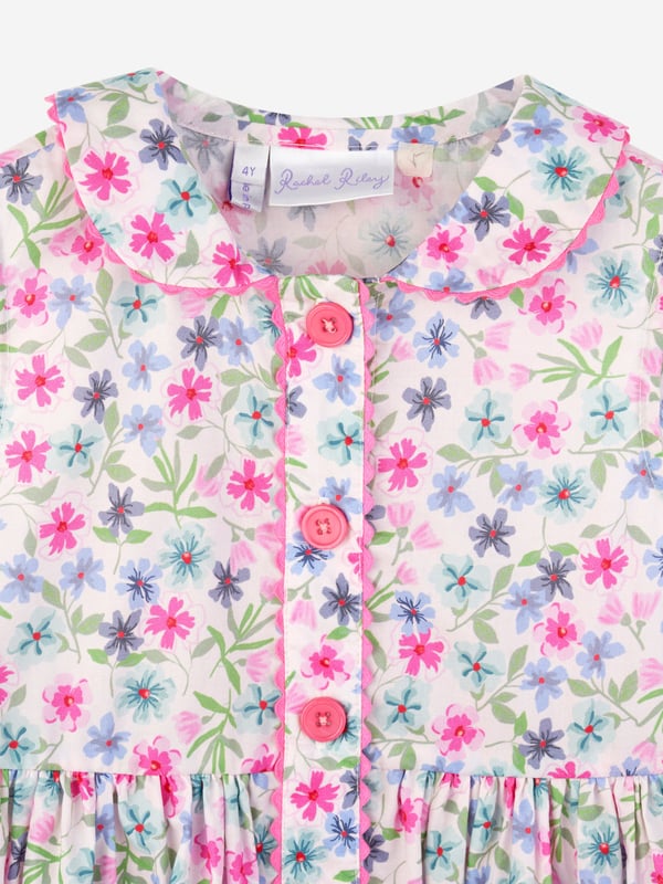 Presenting the Baby Girls Aster Dress and Bloomers in Pink from Rachel Riley, an essential aspect of your baby girl's wardrobe. Exquisitely designed for Easter celebrations, it flawlessly blends charm and cosiness. Key highlights of this high-end product: Chic Design: The captivating print adds a fashionable and playful spin on the dress. Your baby becomes the centre of attention Supreme Comfort: Made from premium material, the dress ensures your Angel's comfort during Easter festivities.  Upgrade your baby's attire! Make this Aster Dress and Bloomers a staple of your child's seasonal wardrobe. Grab it now and let your princess captivate hearts in her new outfits!
