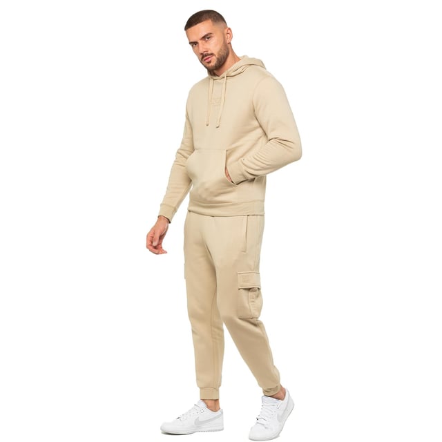Enzo Mens Regular Fit Cargo Joggers. Features 2 Side Slash Pockets, 2 Cargo Pockets, Single Welt Back Pocket. Brushed Back Inner Fleece. Elasticated Waistband With Adjustable Drawstring. Cuffed Ankle. Features EZ Logo.