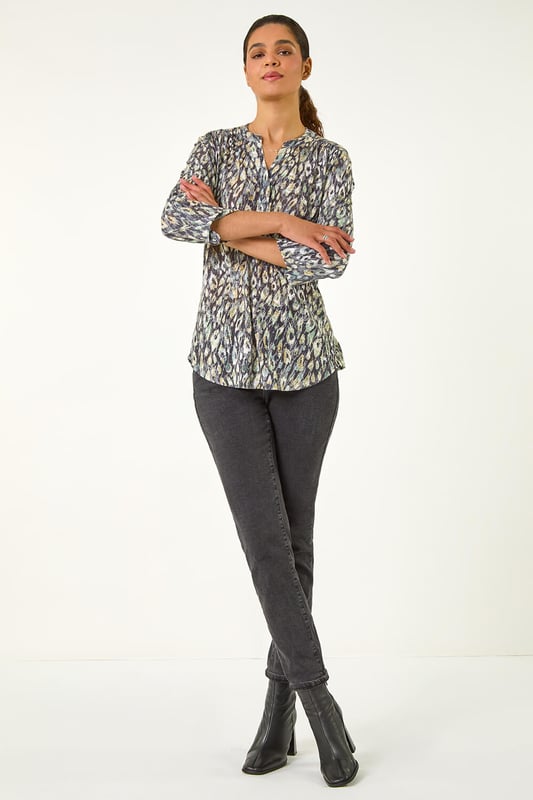 Animal Print Stretch Burnout Top from Roman. Unleash your wild side this Autumn with our fabulous animal print burnout top. Crafted from luxurious jersey fabric, this top features 3/4 tab sleeves and a trendy-notch neckline with a button placket. Falling below the hip, this top is perfect for effortless styling. Pair with your favourite jeans and ankle boots for a fierce and fashionable look that will take you from day to night in style!