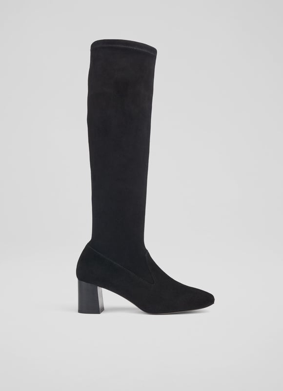 LK Bennett Davina Knee Boots, Black An elevated essential for any winter boot collection, our new Davina knee-boots offer a sleek look and a perfect fit. Crafted in Spain from beautiful black stretch suede, they have a square toe, a slim fit and a 60mm stacked block heel. Pull them on under winter skirts and dresses when it's time to up the winter layers.