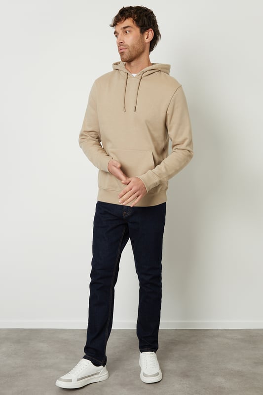 This pull-on hoodie from Threadbare features a kangaroo pocket, elasticated cuffs and hem and an adjustable drawstring hood. Style simply with a pair of matching joggers for laidback loungewear, or team with jeans and trainers for a casual outfit for your weekend outings. Made in a cotton blend fabric to ensure a really comfortable feel. Other colours and matching items available.