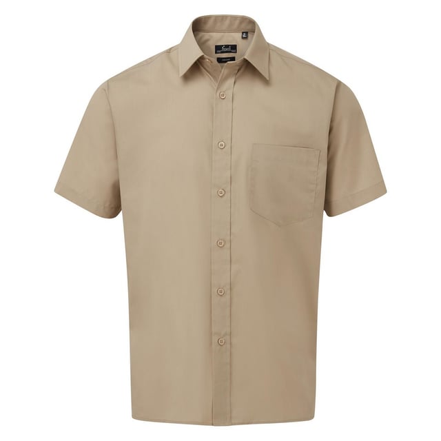 Easy care fabric. Stiffened collar. Back yoke. Left chest pocket. Self colour buttons on dark colours. Straight hem. WRAP Certified Production.