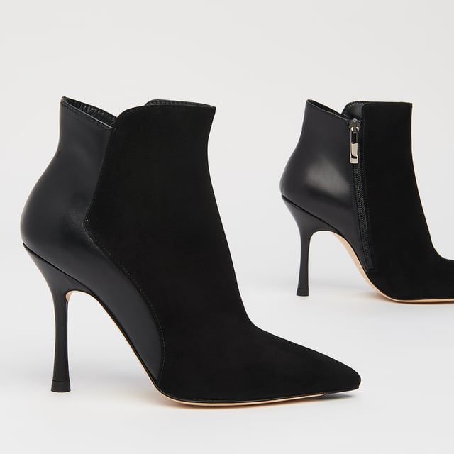 A sexy new style in our autumn/winter shoe collection, our Aliyah ankle boots have incredible shape. Crafted in Spain from a stylish blend of black suede and nappa leather, they have pointed toes, inside zips and 100mm slender heels with flared detail. Sophisticated and stable, wear them with autumn's midi dresses and sleek tailoring alike.