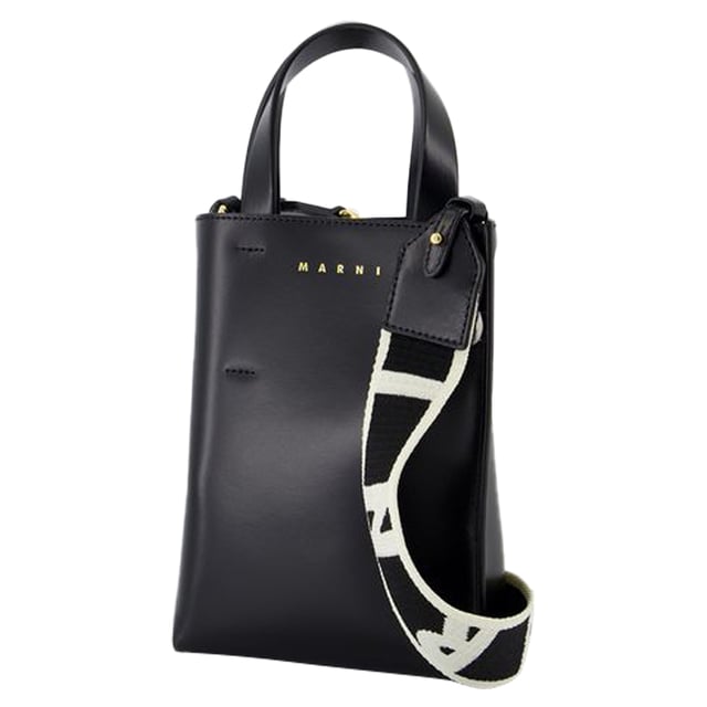 Fit: true to size - Sizing: European. Closure: open top. Interior: two compartments and two zipped pockets.