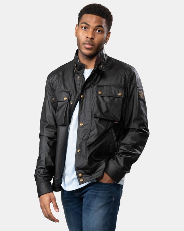 The Racemaster jacket in Faded Olive. There’s more to the Racemaster than meets the eye. Introduced back in 1981, it was originally billed as a shorter version of the iconic Trialmaster. This means that, along with the history, heritage, and dark navy 6 oz. waxed cotton, you also get increased mobility and freedom to move.

6 oz. waxed cotton, with a unique blend of micro and technical waxes
Four external pocket field jacket with reinforcement patches and corduroy details
Water-repellent and wind-repellent
Corduroy linings at the collar, cuffs and hem providing added comfort and resilience at high contact points
Signature antique brass metal hardware with Belstaff England engraved on the round and signature phoenix woven patch on left sleeve
Centre front zip closure with snap closure placket
Buckle-adjusted collar
Two press-stud flap pockets
Two lower zipped pockets
Left internal pocket

Shell: 100% Cotton, Body Lining: 100% CottonSleeve Lining: 55% Polyester, 45% Viscose/Rayon105306