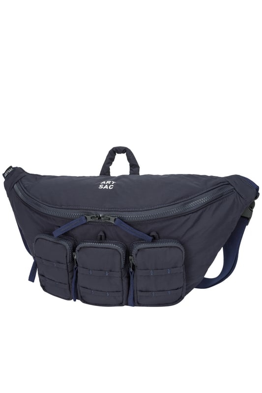 The perfect practial edition to any outfit. This unique triple-pocket design sling bag has enough internal and external space to carry all your every day essentials. Features: , Padded lightweight nylon, Water resistant, Zip top opening to main compartment, ARTSAC screen printed logo, Triple front zip pocket with loops, Internal zip pocket, External rear zip pocket, Top grab handle, 2 Mobile phone internal net pockets, Adjustable shoulder strap allowing backpack styling or bum bag styling Style Ref: 52014 NAVY