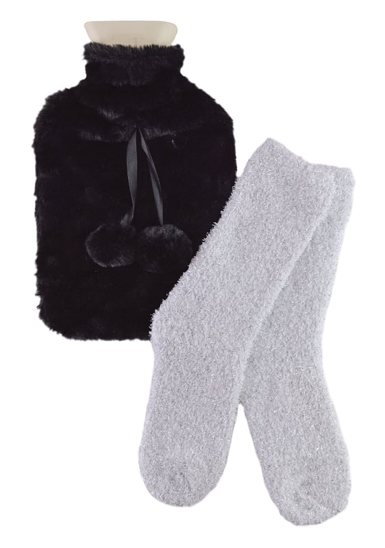 If you're looking for a luxury gift for your friend, family or loved one then look no further than our Hot Water Bottle & Socks Gift Set. This adorable gift set comes with a soft and cosy pair of socks and a 1.5 litre Fur-Like Hot Water Bottle.This luxury style gift set comes with a Fur-Like Hot Water Bottle which holds 1.5 Litres of water which is ideal for keeping you warm on those cold winter nights. It is made from plush microfibre material and it has a cute pom pom decor on top.The cosy pair of socks included are made of a super soft fluffy material which makes them perfect for snuggling up on the sofa when it's cold outside. It's the perfect gift idea and they’re even Machine Washable!We have 3 colour options available which are: Black, Grey or Pink so there is sure to be something for everyone! It makes a great gift to a loved one or Christmas present but it's also perfect if you just want to treat yourself.