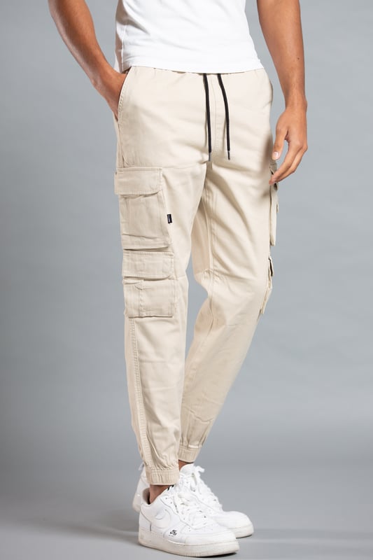 These cargo-style trousers from Tokyo Laundry are wardrobe staples. Made from soft cotton fabric, these trousers are perfect for everyday wear. Featuring two side pockets, four cargo-style pockets and two back pockets, a drawstring with toggle, elasticated waistband and cuffs and Tokyo Laundry branding on the front. Machine washable for easy care.