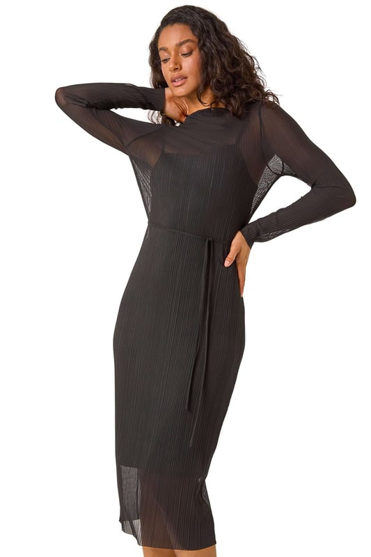 Dusk Pleated Plisse Stretch Mesh Midi Dress from Roman. Let your style shine this season in our elegant mesh midi dress. The pleated design falls at midi-length while the bodycon fit creates a flattering silhouette. Featuring a round neckline and long set-in-sleeves this dress is crafted from a woven stretch fabric for easy pull-on style. Pair with your favourite winter boots, tights, and coat for a complete Autumn look!