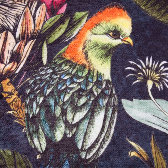The Leilani Twilight cushion features two elegant birds nestled among striking tropical flowers. Hand-painted and printed with fine detail, its vibrant palette contrasts vivid hues against deep midnight tones. This bold yet charming piece adds a touch of exotic elegance and sophistication to any space.