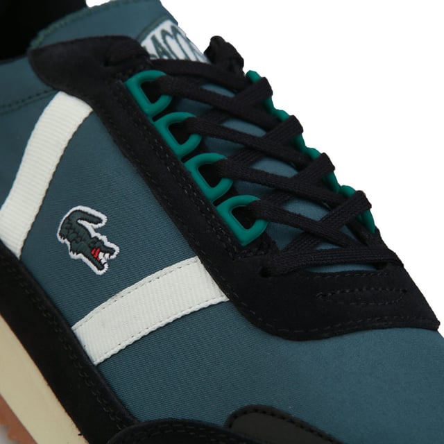 Men's Lacoste Partner Retro Trainers in Green Mens Lacoste Partner Retro Trainers in green.- Leather and suede uppers.- Lace up fastening.- Lacoste patch on the tongue.- Tonal branding on the heel and a green embroidered crocodile on the quarter.- Rubber outsole.- Suede and Leather upper Textile lining Synthetic sole.- Ref: 738SMA00061X3