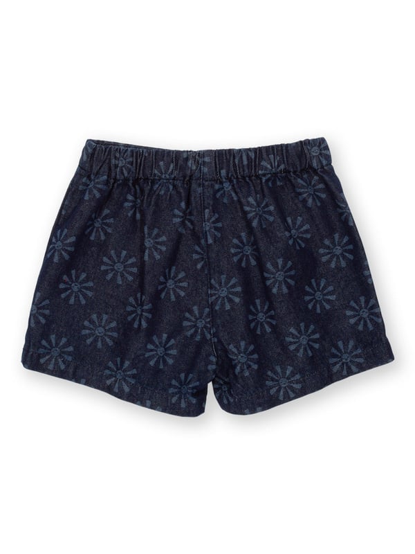 100% organic cotton |  Light navy etched smiley sun design |  Navy blue |  Lightweight denim fabric |  Apple enzyme washed for a soft hand feel |  Skirt with matching built-in shorts |  Single front pocket |  Elasticated waistband |  Made in Turkey |  Machine washable at 40 degrees, or at 30 degrees to be kinder to the planet