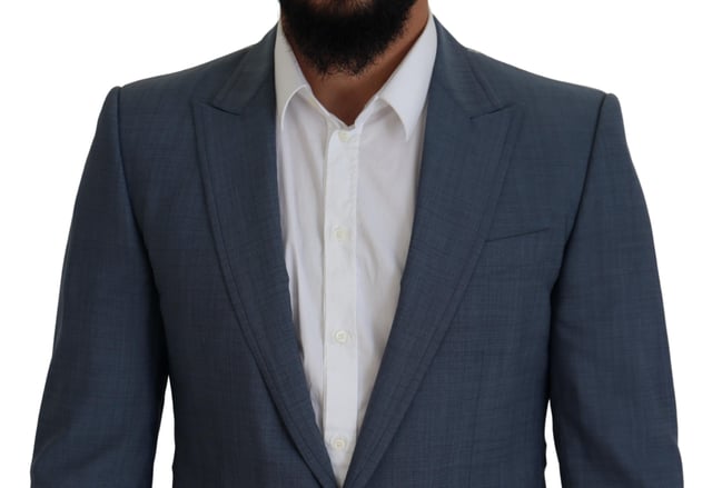 Absolutely stunning 100% Authentic brand new with tags Dolce & Gabbana blazer
  Single breasted style with a blue color and blue inner lining
  Two-button closure
  Logo details
  Made in Italy
  Material: 92% Wool 7% Elastane 1% Polyester
  Lining: 36% Cupro 33% Rayon 31% Acetate
Material: 92% Wool 7% Elastane 1% Polyester