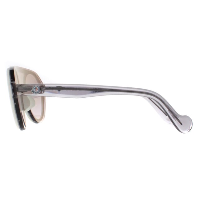 Moncler Round Unisex White Transparent Grey Grey ML0052  Sunglasses are a modern round style featuring a top bar for added comfort. The lightweight acetate frame features the Moncler logo on the temples for brand recognition.